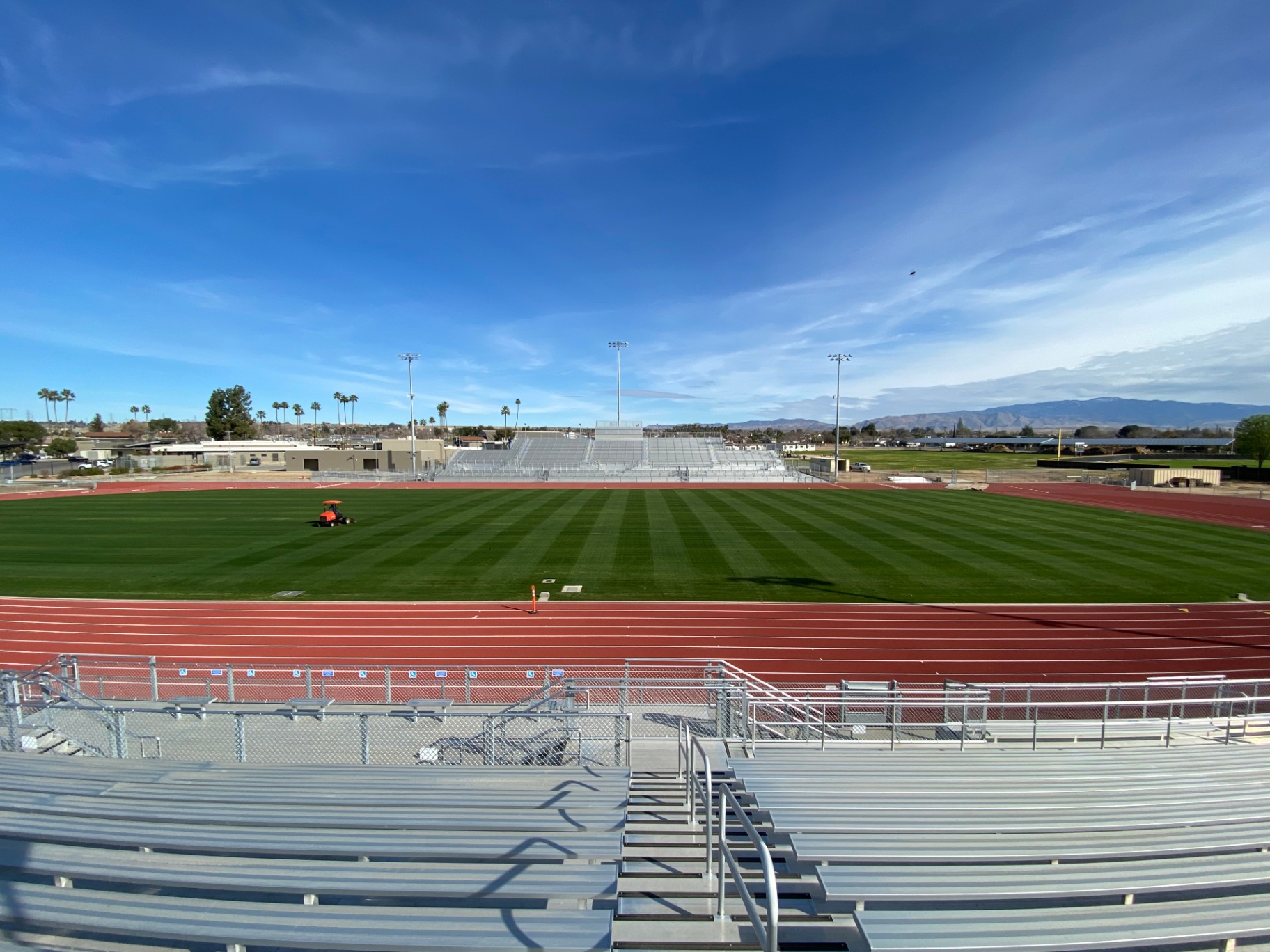 Foothill HS football field — freshly mowed with mountain backdrop